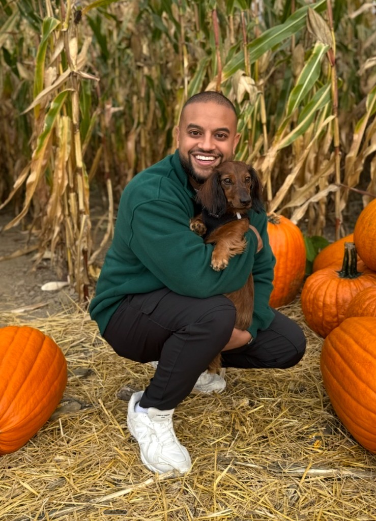 Marvin's Dad holding Marvin at a pumpkin patch